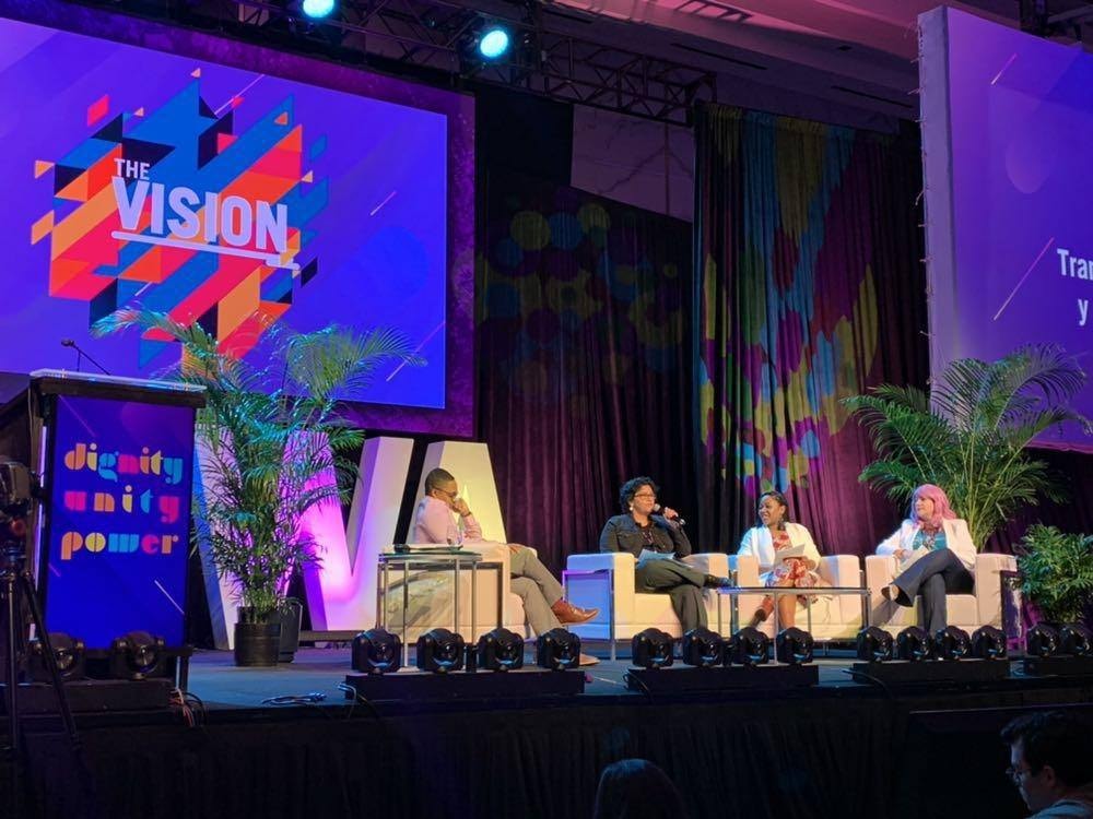 Thaty speaking at a professional conference